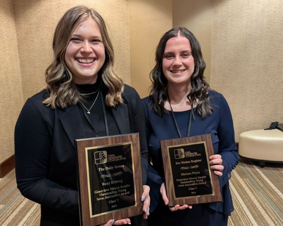 Roxy and Marissa hold their awards