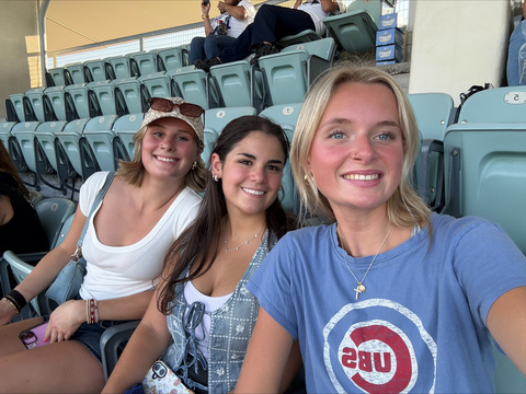 This is a photo of AWSM students Megan Heine, Morgan Burhans, and Elise Gan at a Dodgers game..
