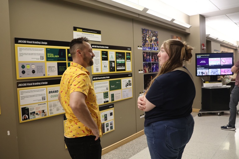 This is a photo of Kevin Ripka and a student at the 2026 Student Exhibition