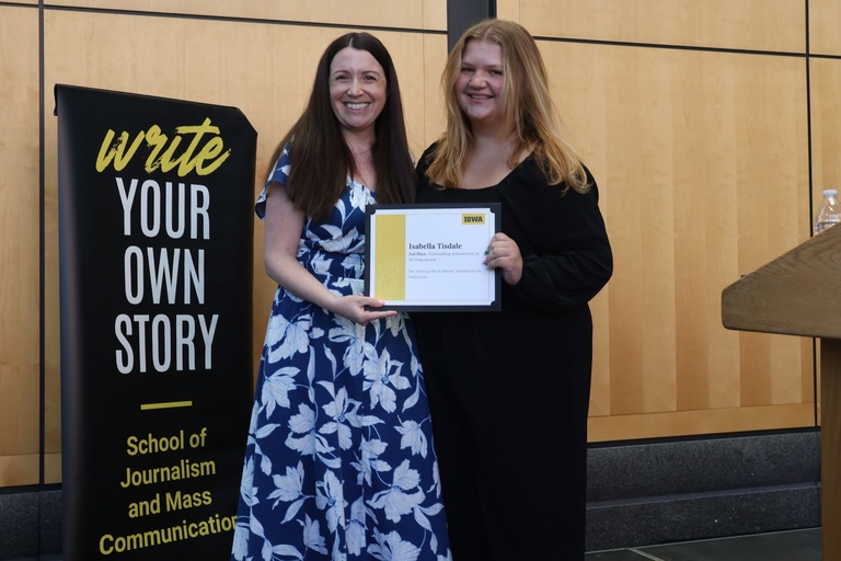 This is a photo of SJMC student Isabelle Tisdale receiving Runner up for the Outstanding Achievement in Writing Award