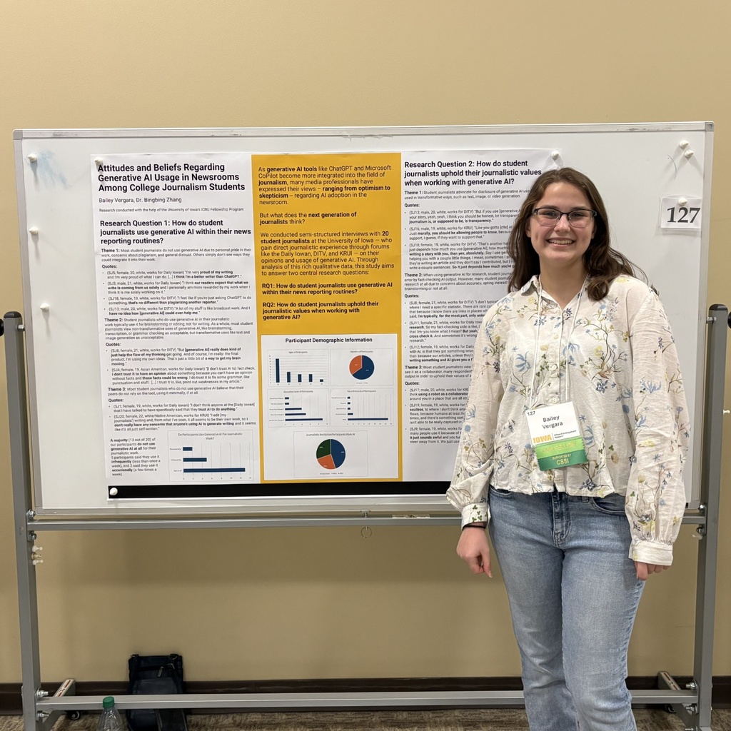 This a photo of SJMC student Baily Vegara presenting her academic poster about AI use in the newsroom.