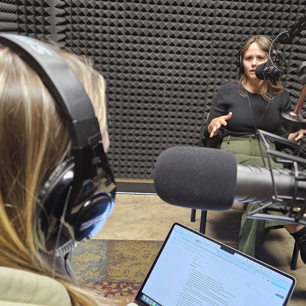 This is a photo of About the Abstract host Jacy West and PhD Candidate Sarah Witmer.