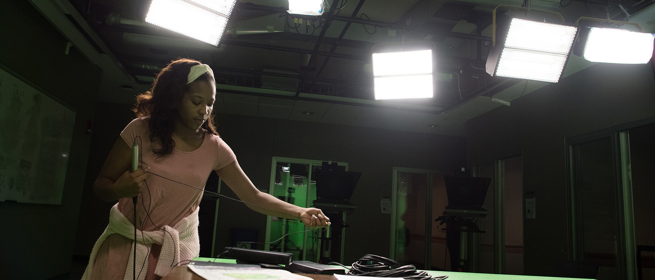 a woman working in a broadcast studio