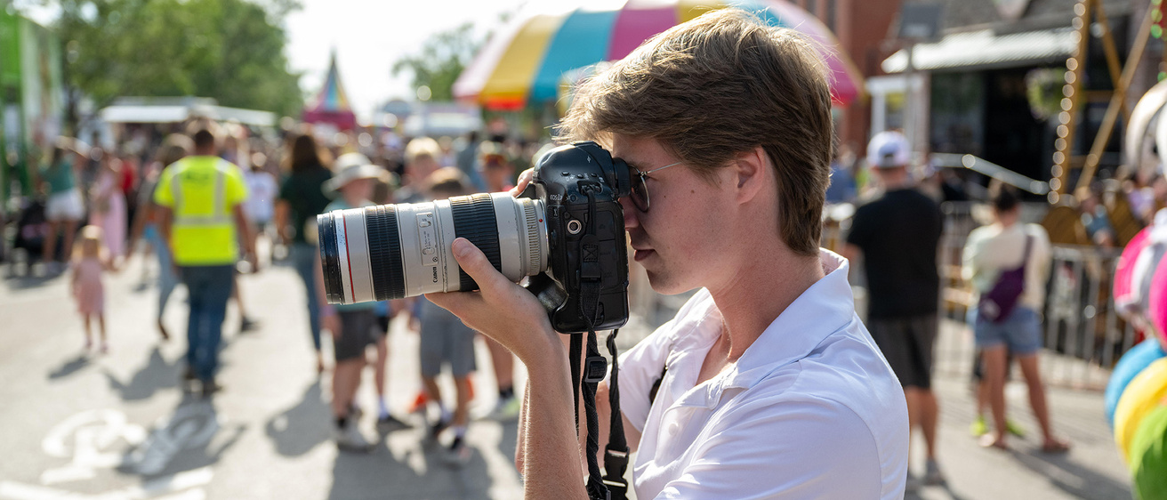 a photographer working at a community event