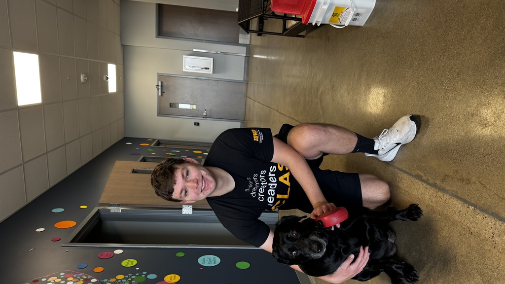 This is a photo of SJMC student Jered Kerr with his dog.